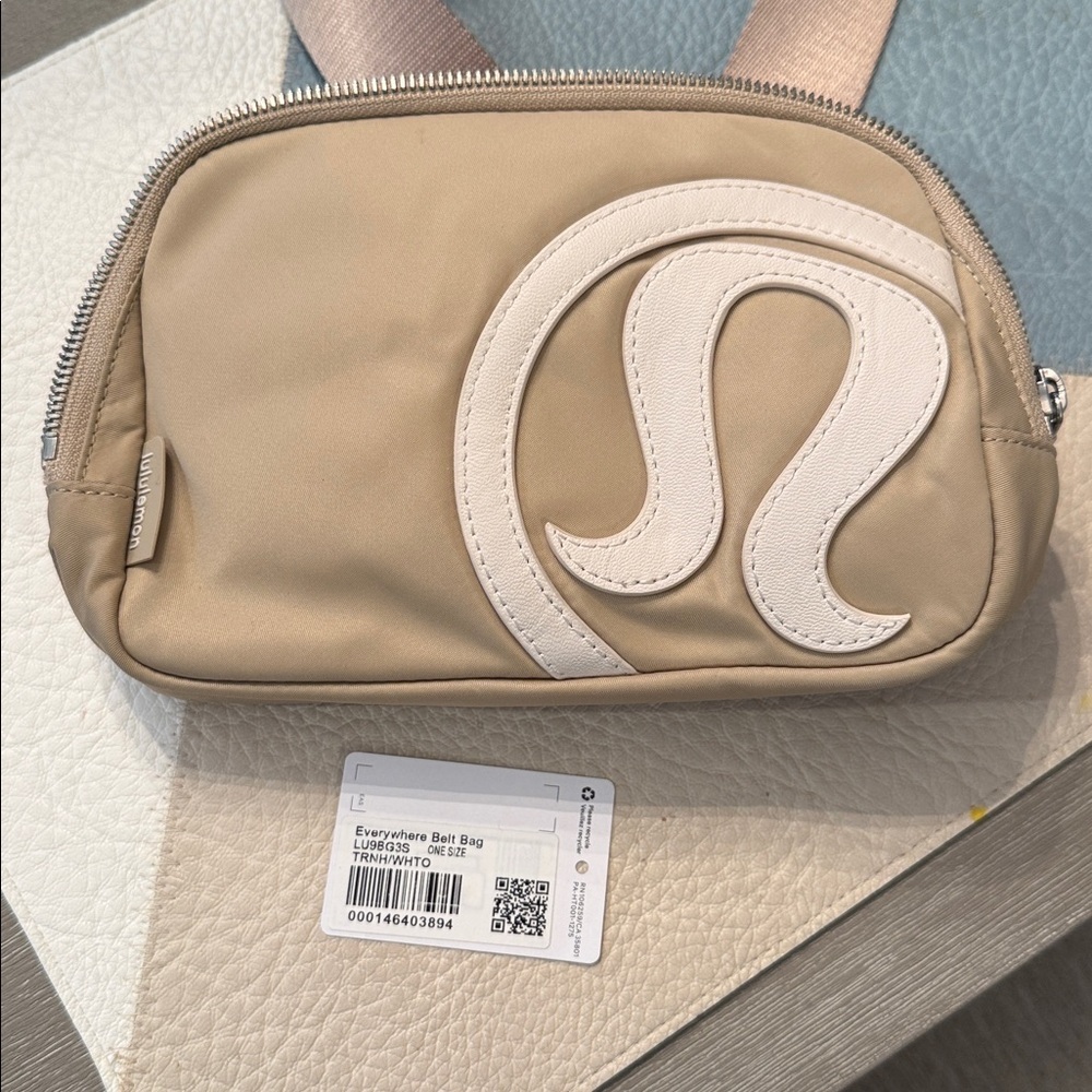 lululemon Everywhere Belt Bag 1L with a raised logo in the Trench/White Opal - Picture 2 of 4